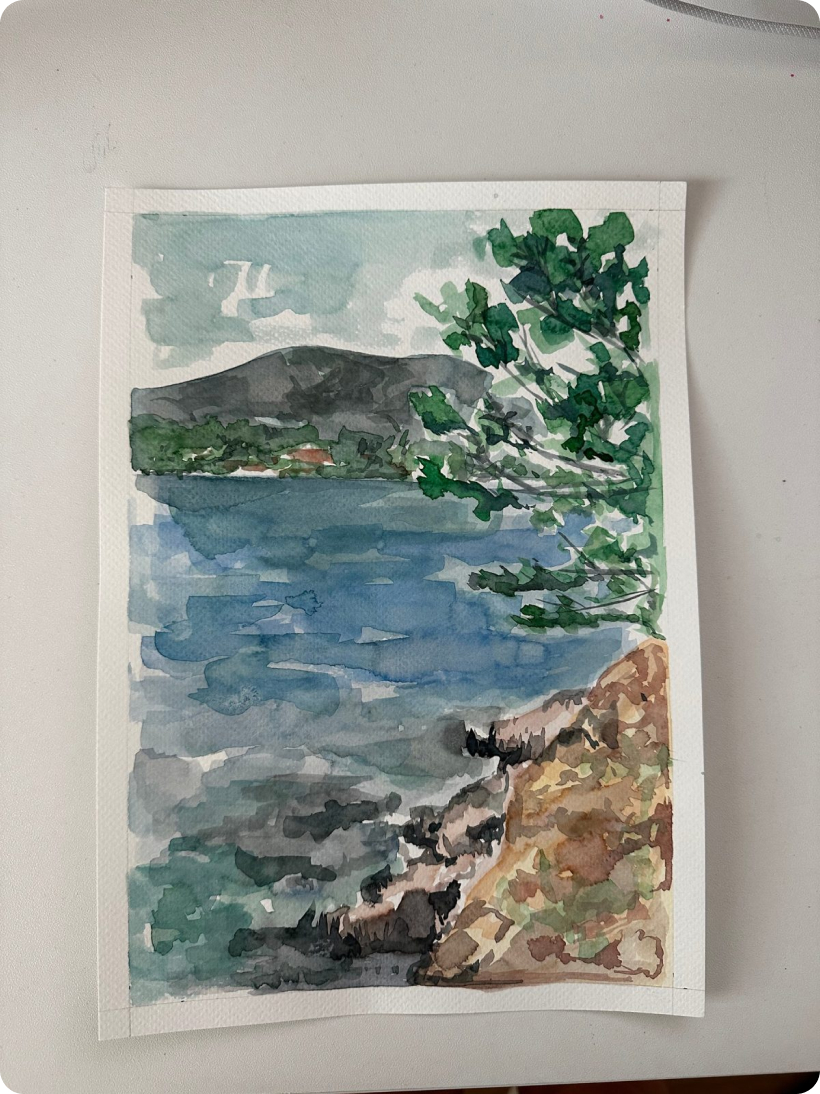 Watercolor of a lake with mountains and green trees