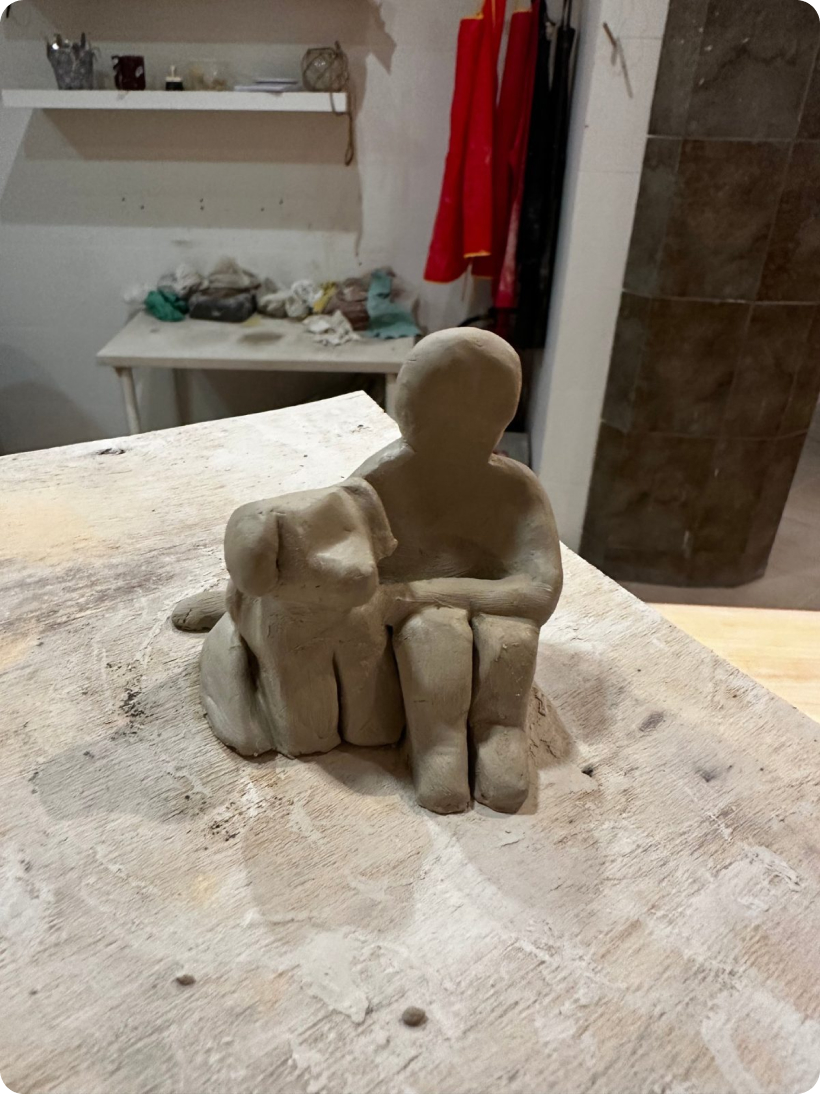 Clay figures sitting side by side