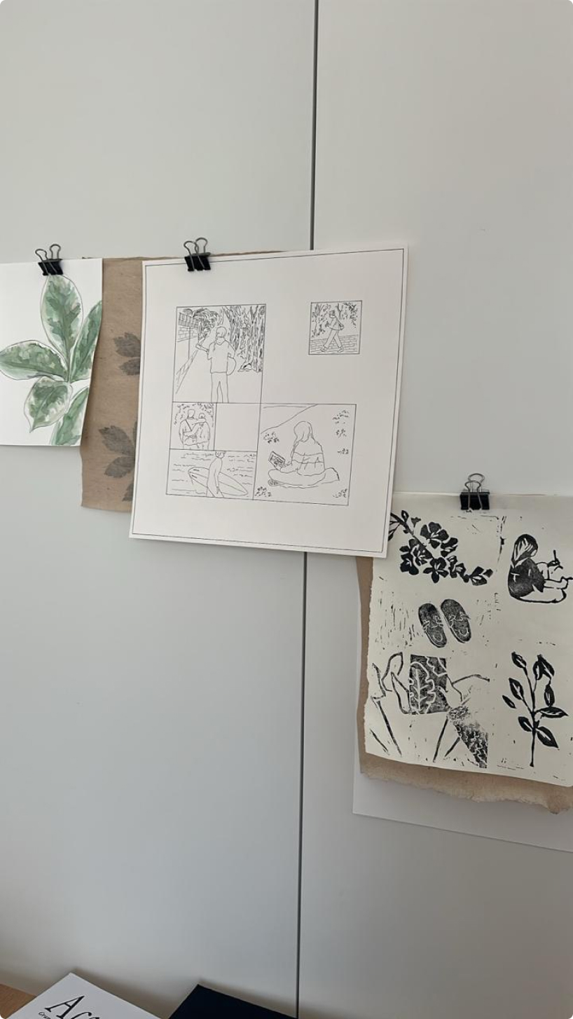 Ink sketches pinned to a wall
